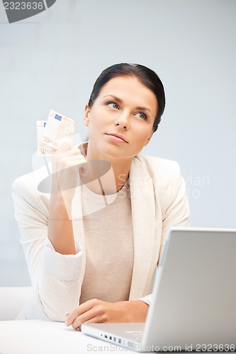 Image of lovely woman with euro cash money