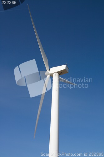 Image of windmill against blue sky