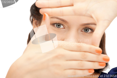 Image of lovely woman creating a frame with fingers