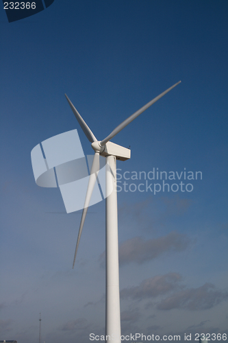 Image of windmill against blue sky