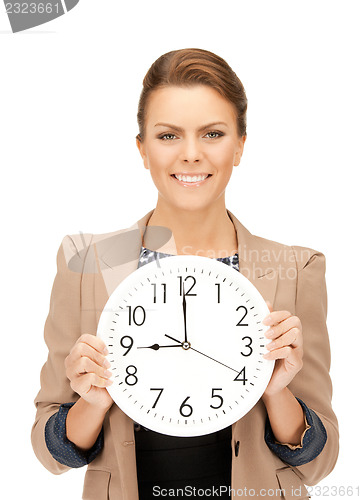 Image of woman holding big clock