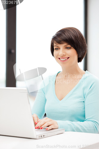 Image of happy woman with laptop computer