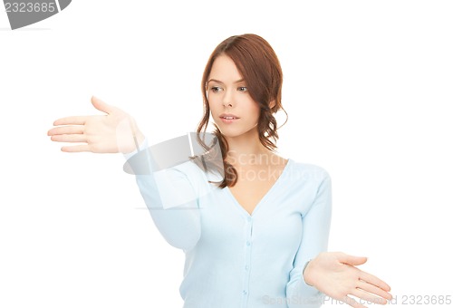 Image of businesswoman working with something imaginary