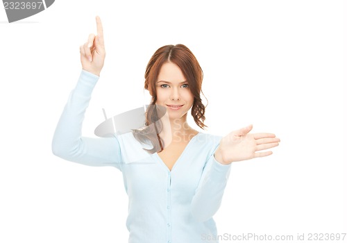 Image of businesswoman working with something imaginary