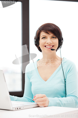 Image of helpline operator with laptop computer