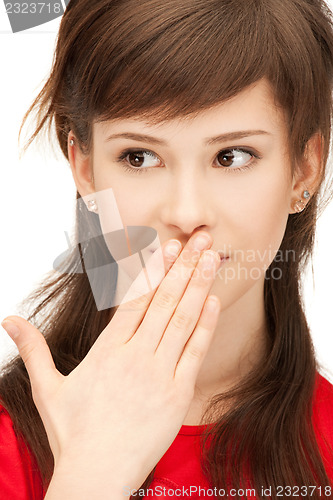 Image of teenage girl with palms over mouth