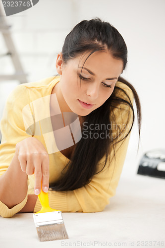 Image of lovely housewife painting