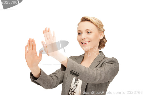 Image of businesswoman working with something imaginary