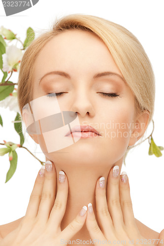 Image of beautiful woman with orchid flower