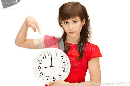 Image of teenage girl holding big clock