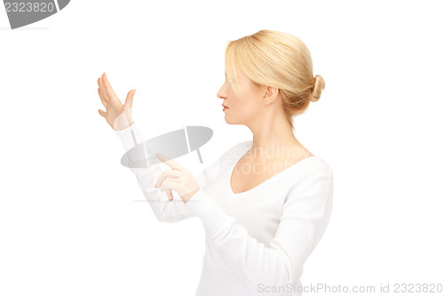Image of businesswoman working with something imaginary
