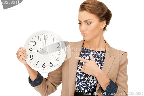 Image of woman holding big clock