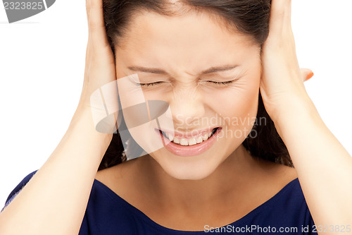 Image of woman with hands on ears