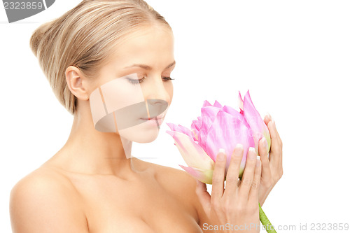 Image of beautiful woman with lotus flower