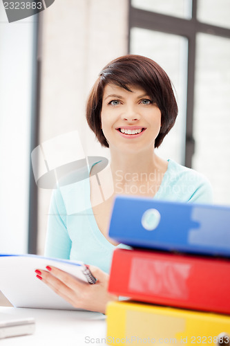 Image of woman with folders