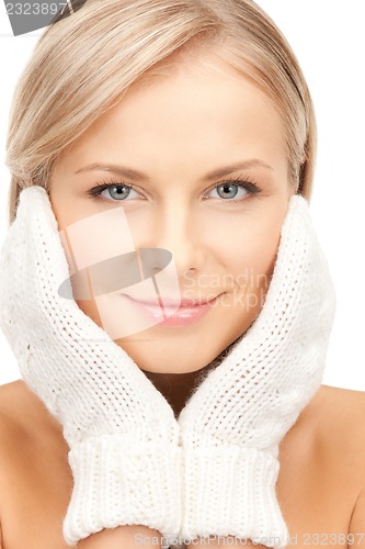 Image of beautiful woman in mittens