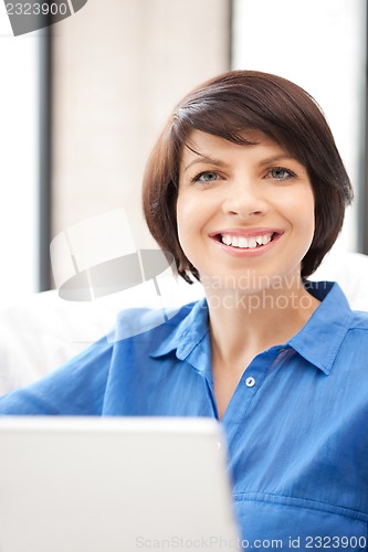Image of happy woman with laptop computer
