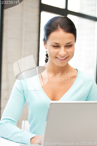 Image of happy woman with laptop computer