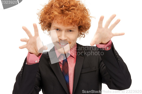 Image of businessman working with something imaginary