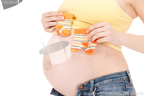 Image of pregnant woman belly and twin socks