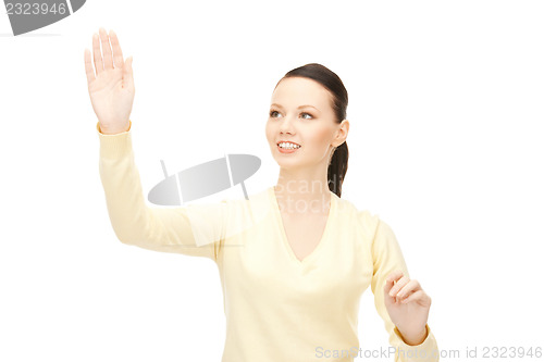 Image of businesswoman working with something imaginary