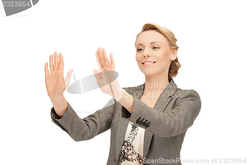 Image of businesswoman working with something imaginary