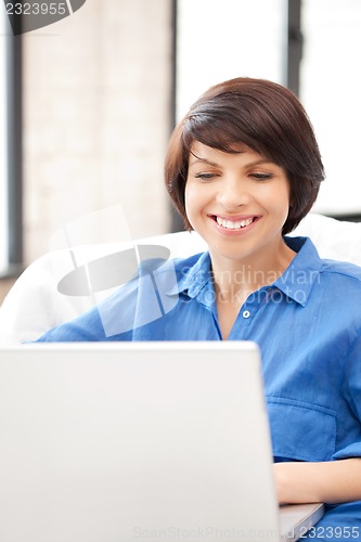 Image of happy woman with laptop computer