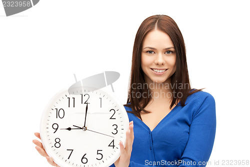 Image of woman holding big clock