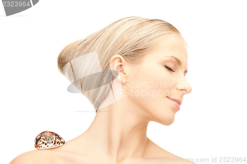 Image of beautiful woman with seashell