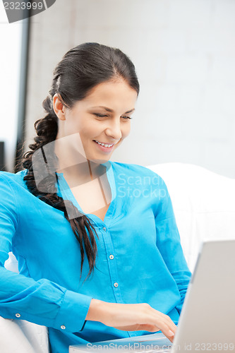 Image of happy woman with laptop computer