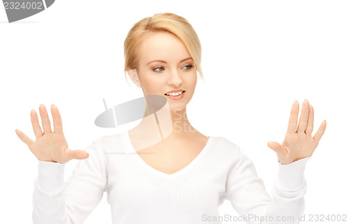 Image of businesswoman working with something imaginary