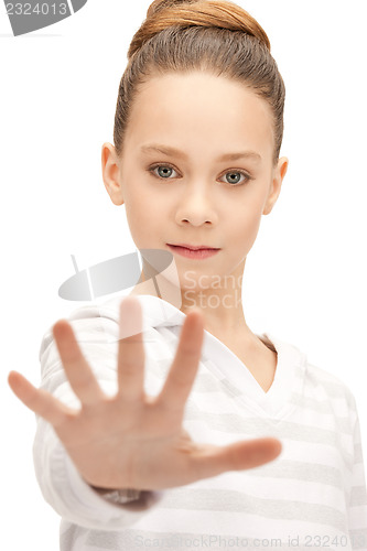 Image of teenage girl making stop gesture