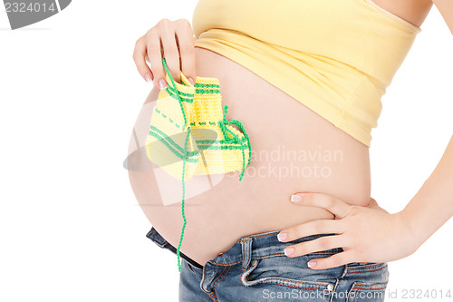 Image of pregnant woman belly and socks