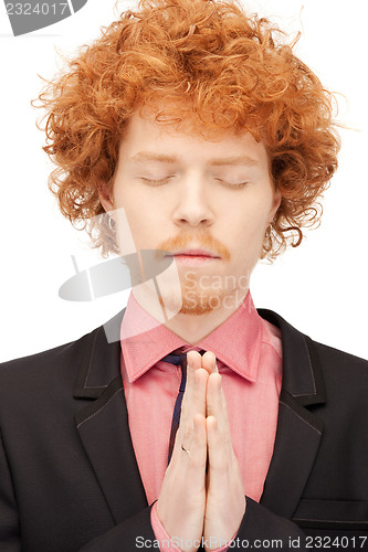 Image of praying businessman