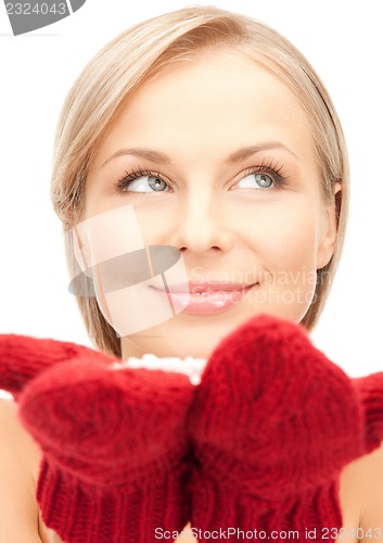 Image of woman in mittens with snow