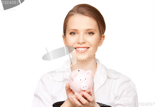 Image of lovely woman with piggy bank