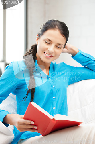 Image of happy and smiling woman with book