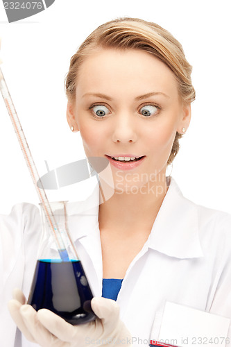 Image of lab worker holding up test tube