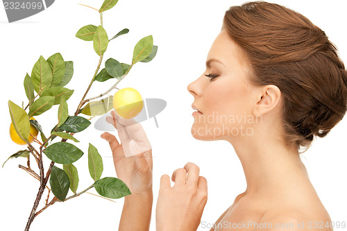Image of lovely woman with lemon twig