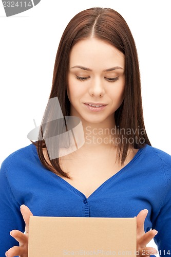 Image of attractive businesswoman with cardboard box