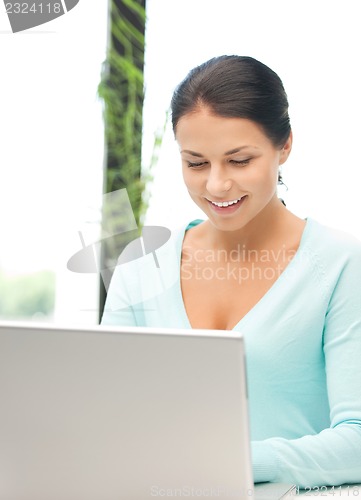 Image of happy woman with laptop computer