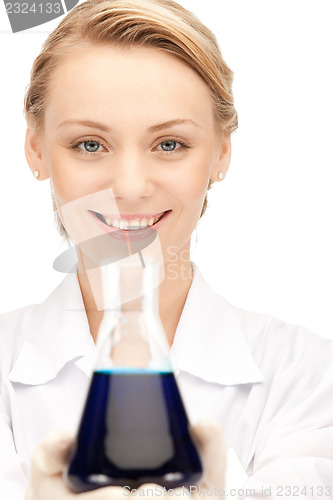 Image of lab worker holding up test tube