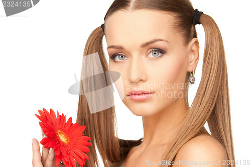 Image of lovely woman with red flower