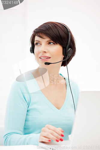 Image of helpline operator with laptop computer