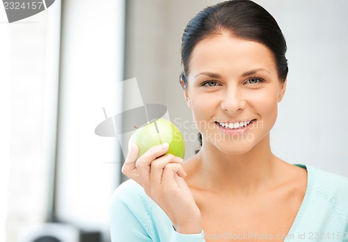 Image of lovely housewife with green apple
