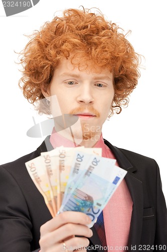 Image of handsome man with euro cash money