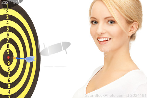 Image of businesswoman with dart and target