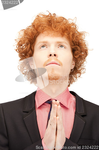 Image of praying businessman