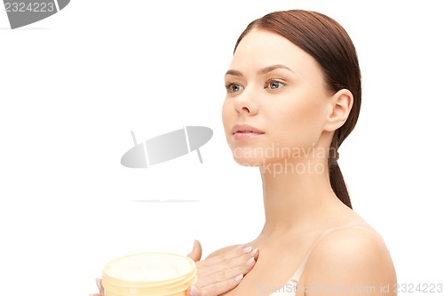 Image of beautiful woman with moisturizing creme