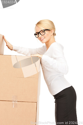 Image of attractive businesswoman with big boxes